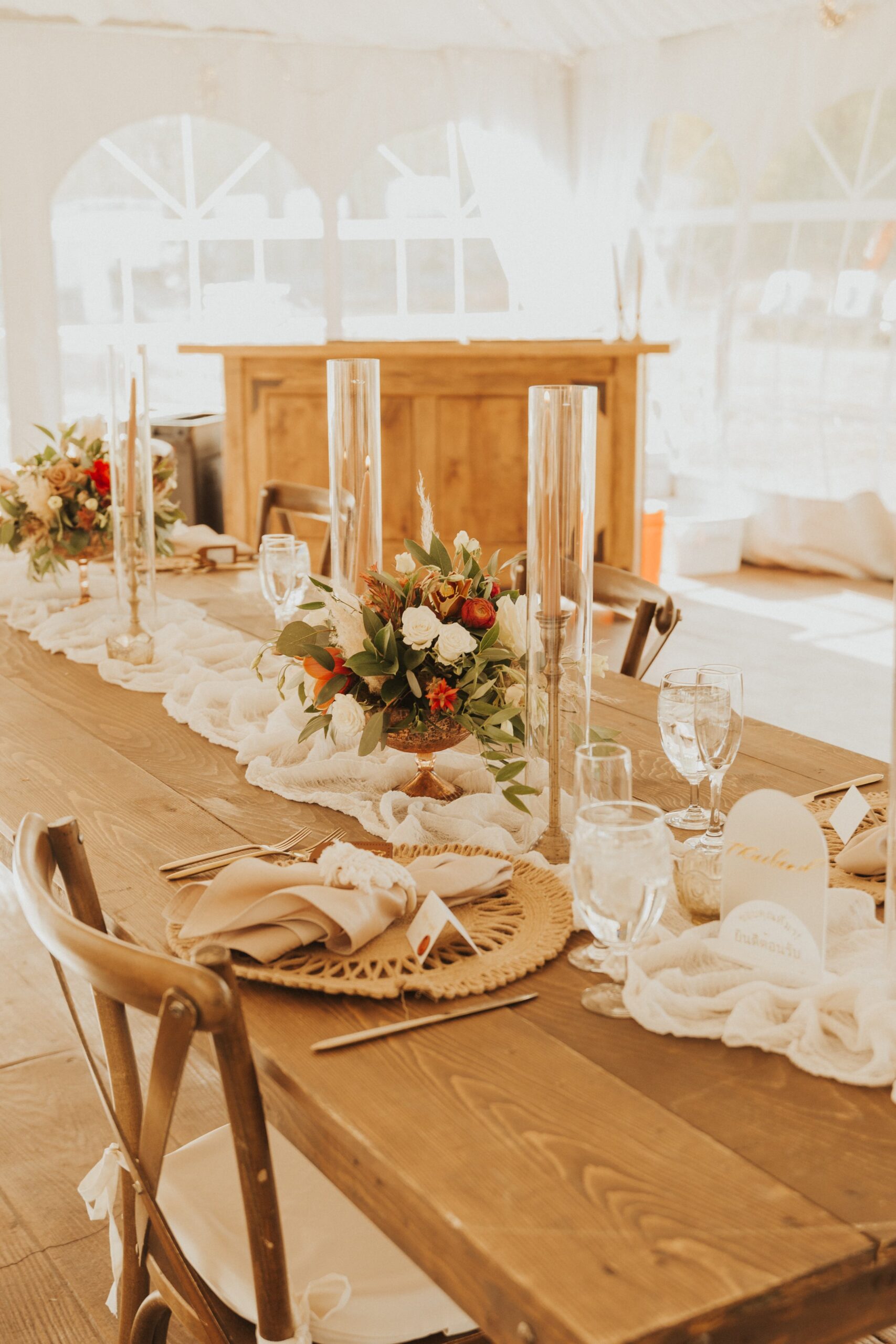 farm house tables and boho decor table settings at Camp Hale wedding