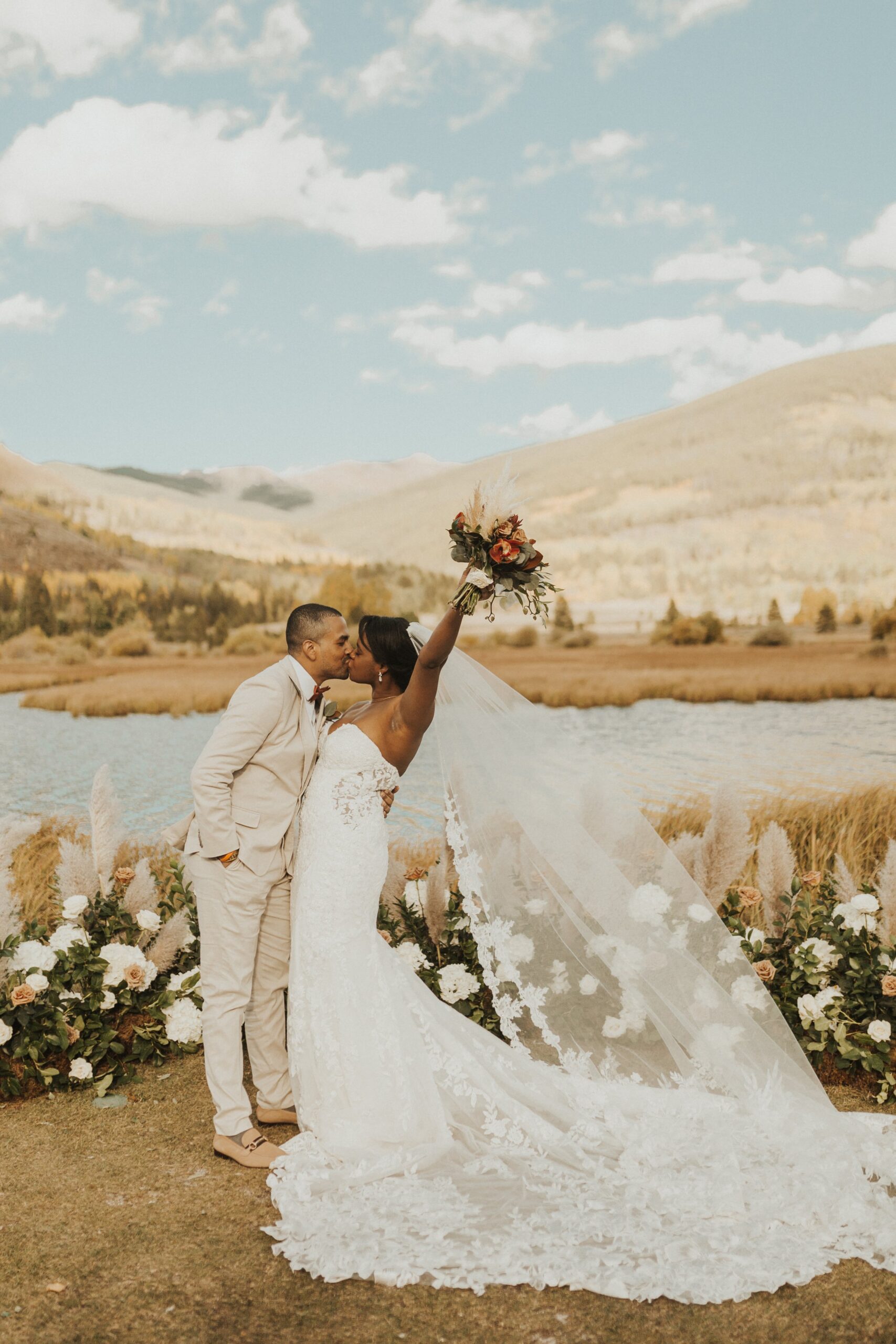 wedding portraits at Camp Hale along waterfront in Vail, CO