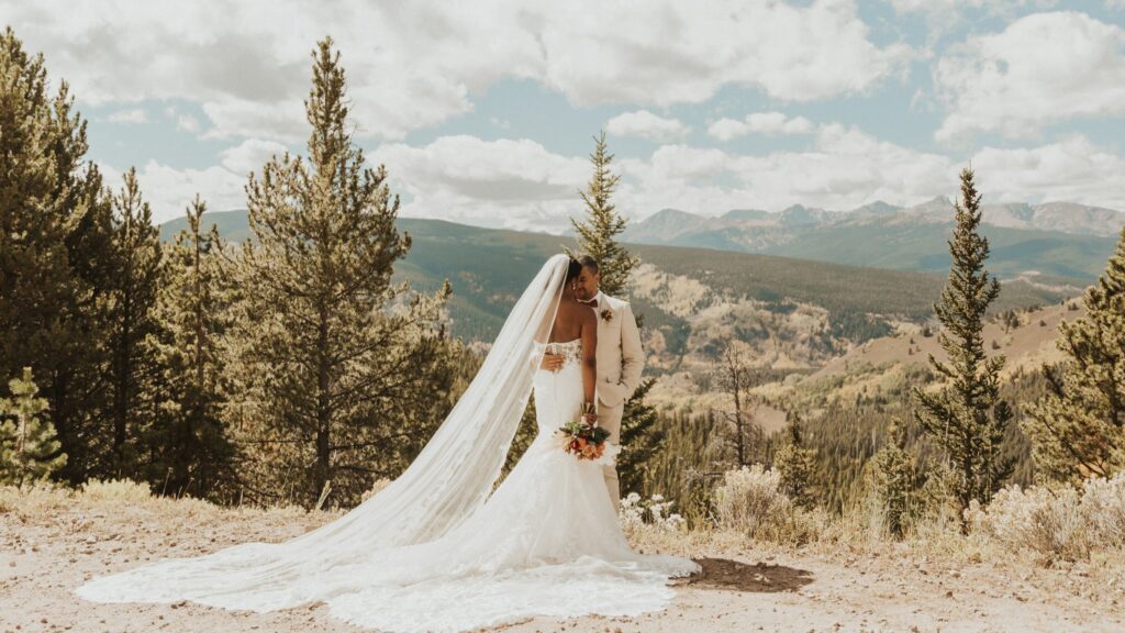 bride and groom with Colorado mountain landscape in Vail