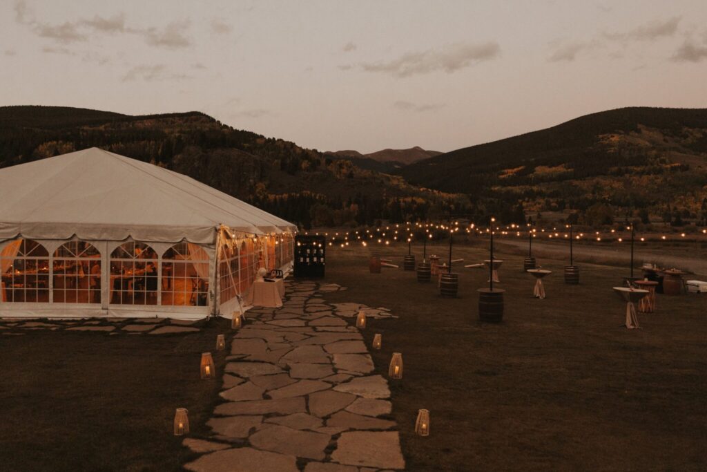 Camp Hale wedding reception tent and cocktail hour area at dusk